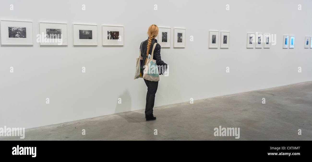 New York City, NY, USA, Woman alone Visiting inside Photography Art Galleries, in the Chelsea Area, art gallery walls, Tourists Stock Photo