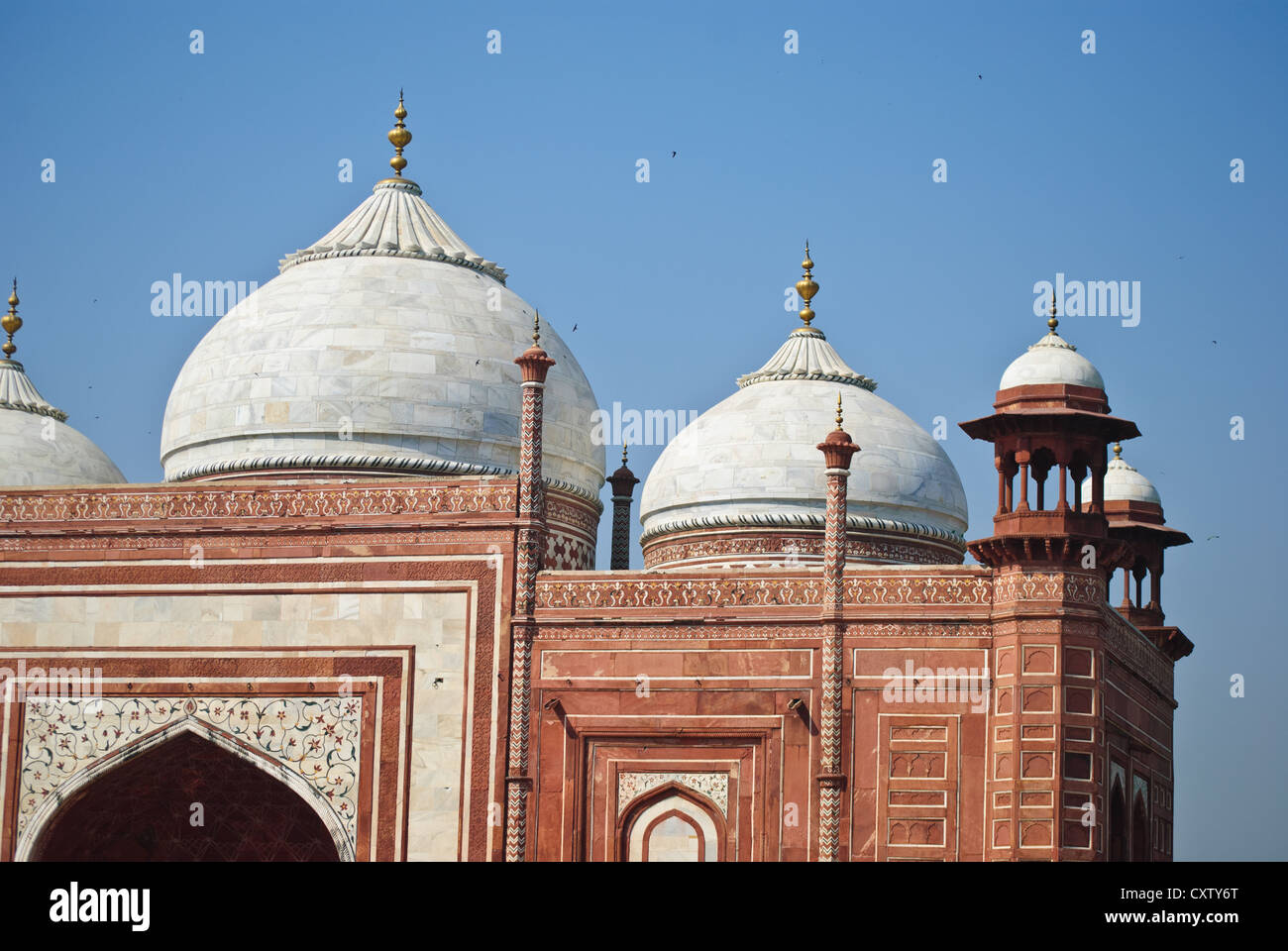 Re sandstone building with marble tops of the mosque in Taj Mahal Stock Photo