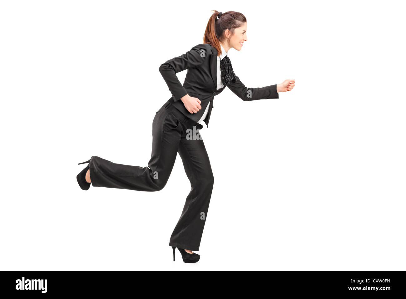 Full length portrait of a businesswoman in hurry running isolated on white background Stock Photo