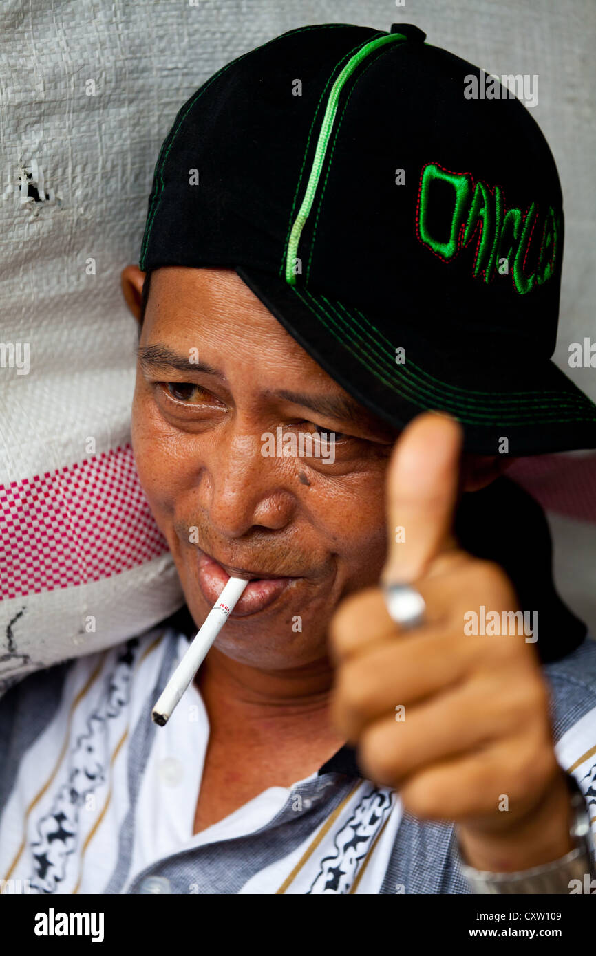 Smoking Man in Banjarmasin, Indonesia Stock Photo