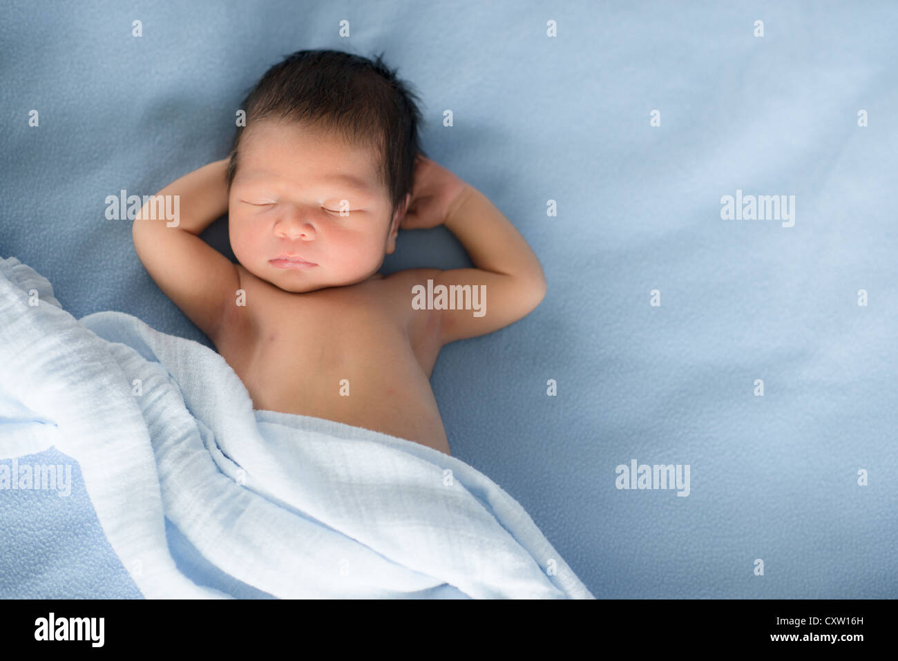 Newborn (5 day old) baby boy sleeping on blue blankets Stock Photo Alamy(01)