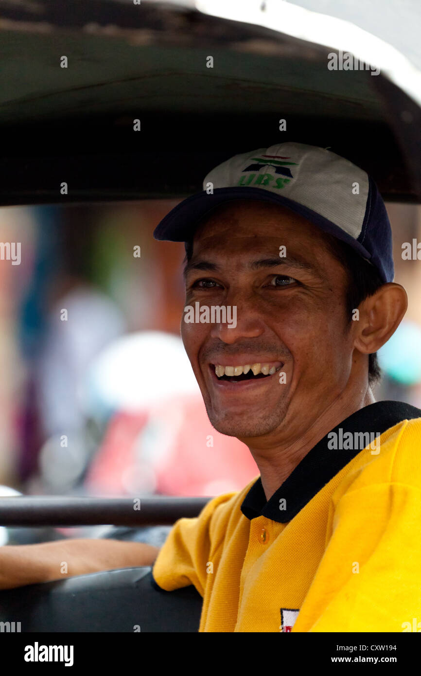 Rickshaw Driver in Banjarmasin, Indonesia Stock Photo