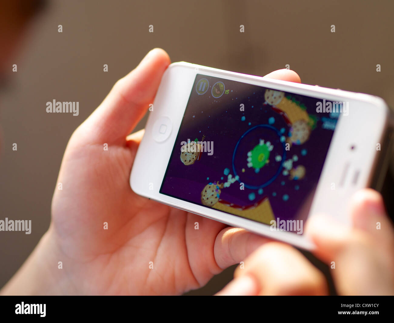 Playing video games on a mobile phone Stock Photo Alamy