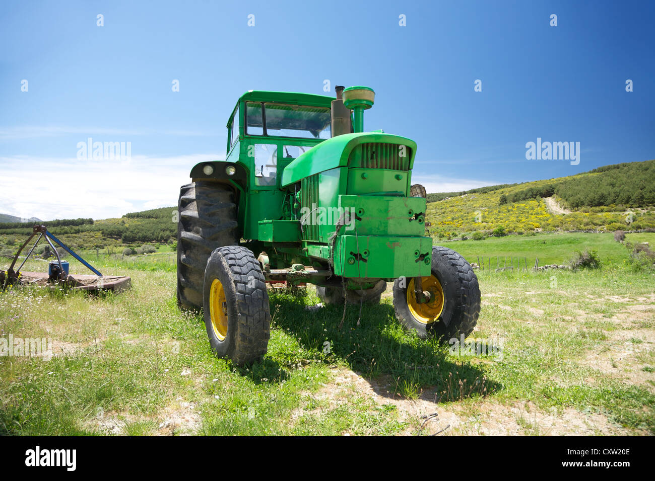 old green tractor at Gredos mountains in Avila Spain Stock Photo - Alamy