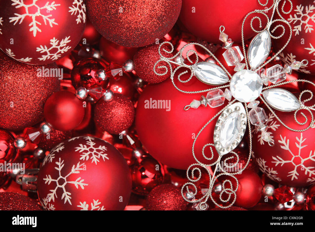 Glitter ornament on red balls. Stock Photo