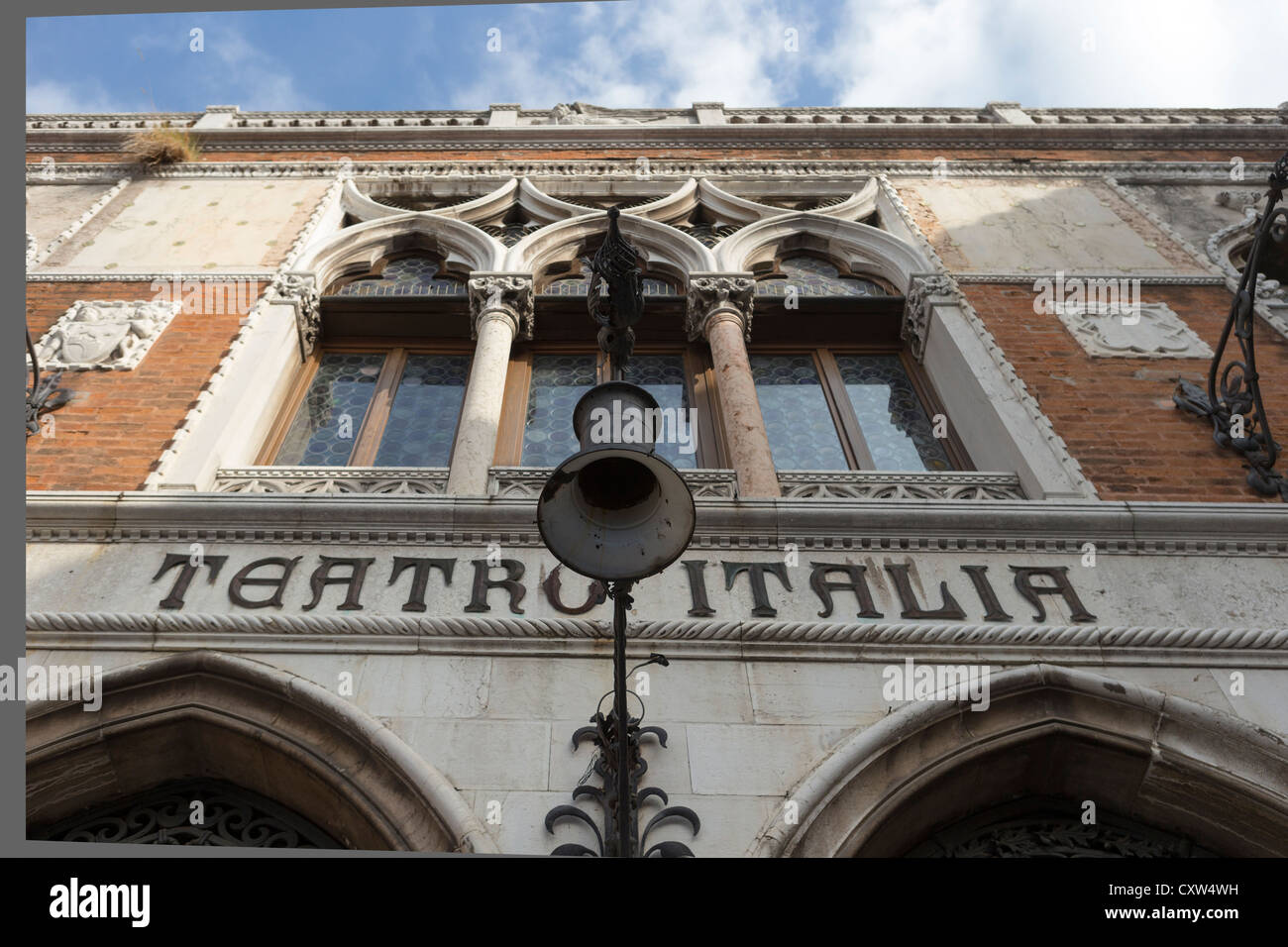 Facade of the Teatro Italia (Italian Theatre) in Venice, showing typical Gothic architecture and wrought-iron lettering Stock Photo