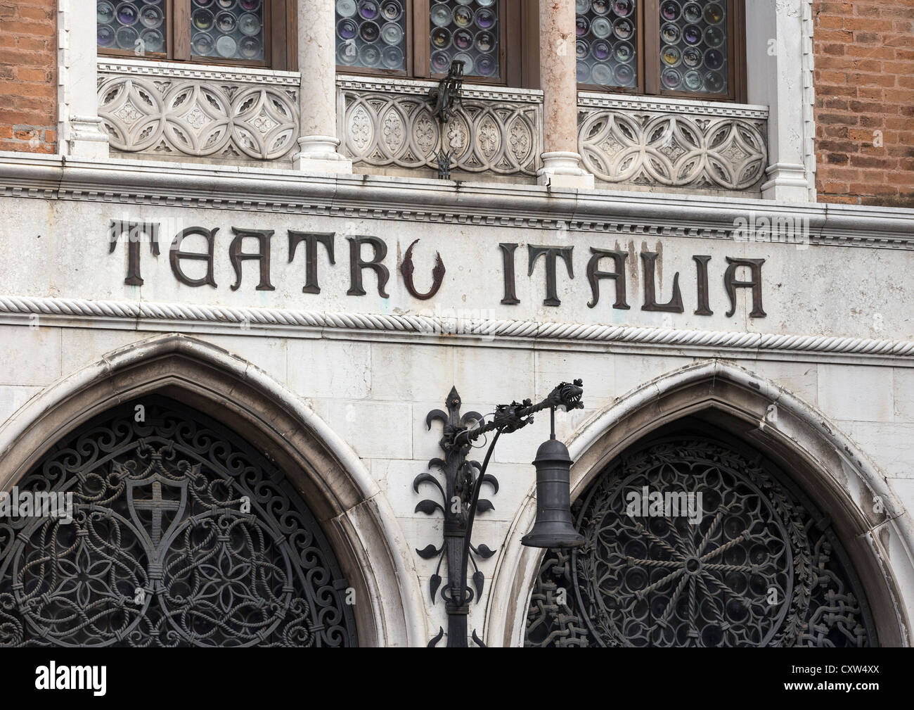 Detail of the facade of the Teatro Italia, showing lettering in wrought iron and typical Venetian Gothic architecture. Stock Photo