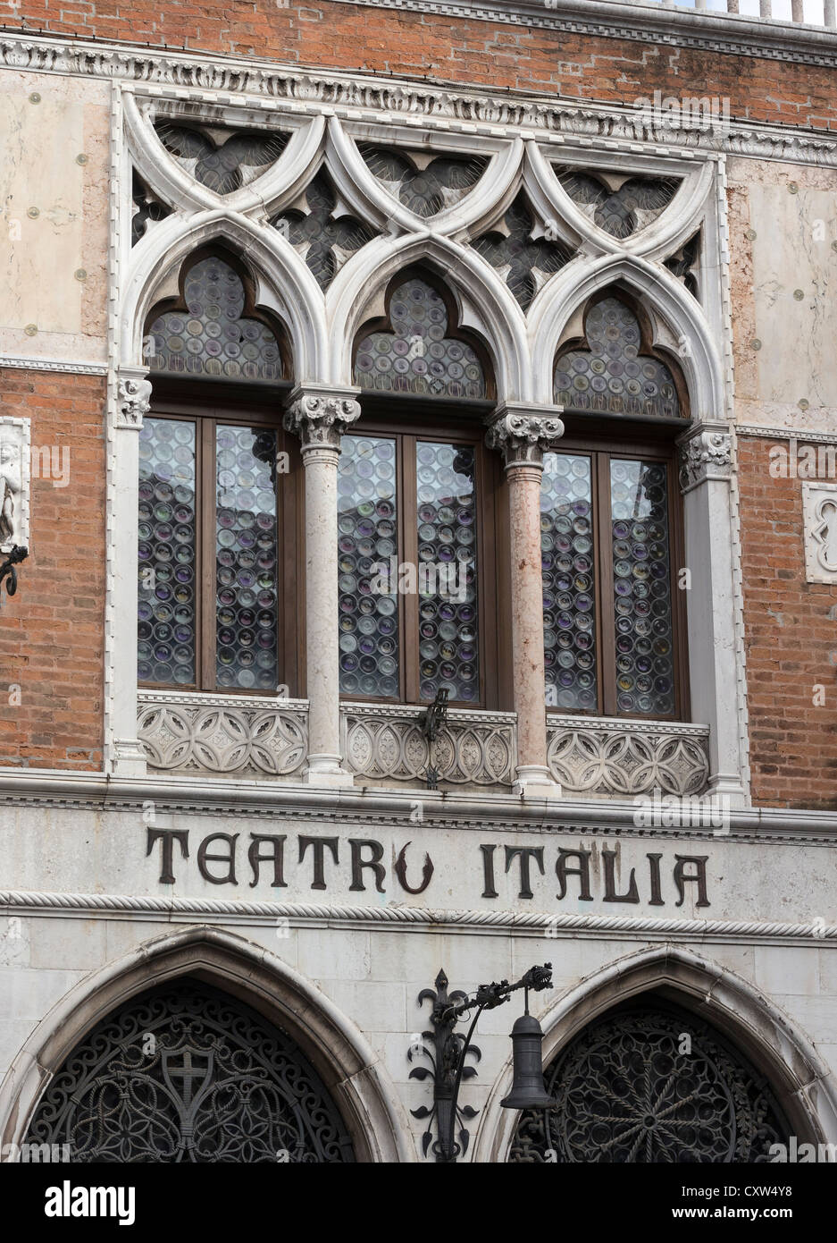Detail of the facade of the Teatro Italia, showing lettering in wrought iron and typical Venetian Gothic architecture. Stock Photo