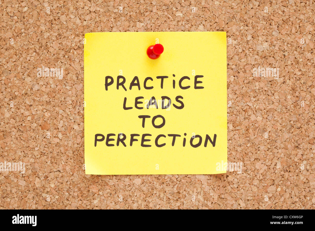 Practice leads to perfection, written on an yellow sticky note on a cork bulletin board Stock Photo