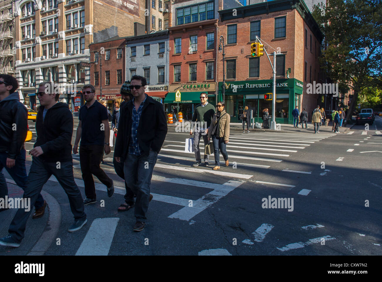 New York City, NY, USA, Pedestrians Crossing Street on Sixth Avenue in Greenwich Village Area, Manhattan, urban walking Stock Photo