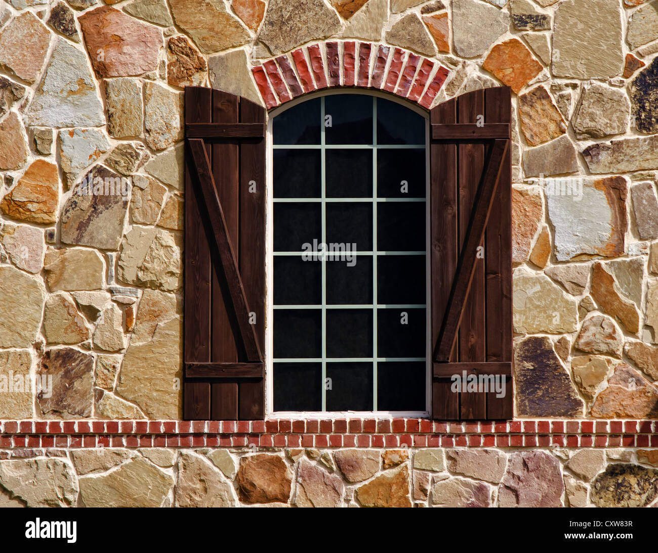 Window on stone wall of southern home Stock Photo