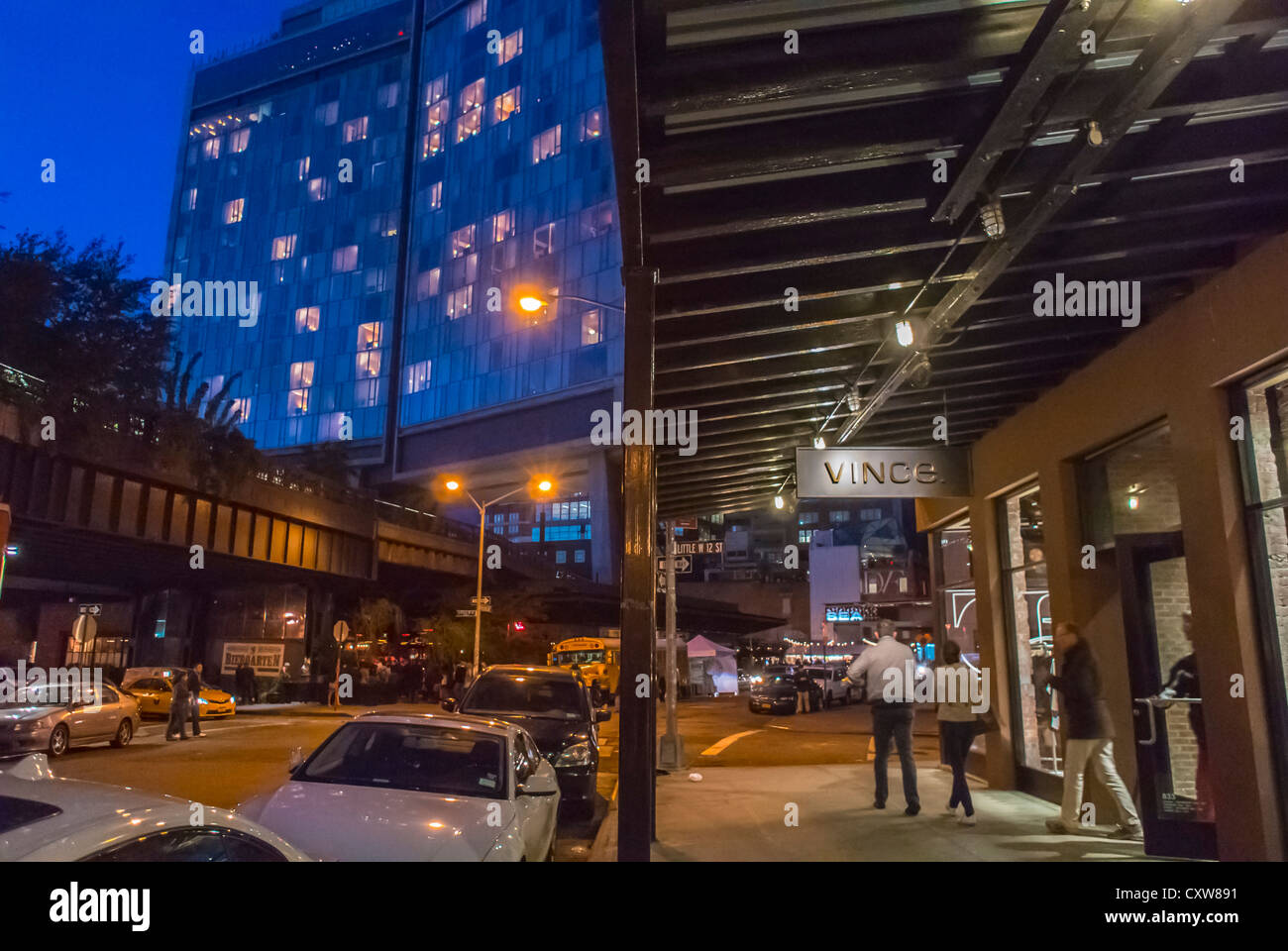 New York City, NY, USA, Street Scenes, Fashionable Stores at Night, in the Meatpacking District, Manhattan, Standard Hotel Building in Back, outdoor lights Stock Photo