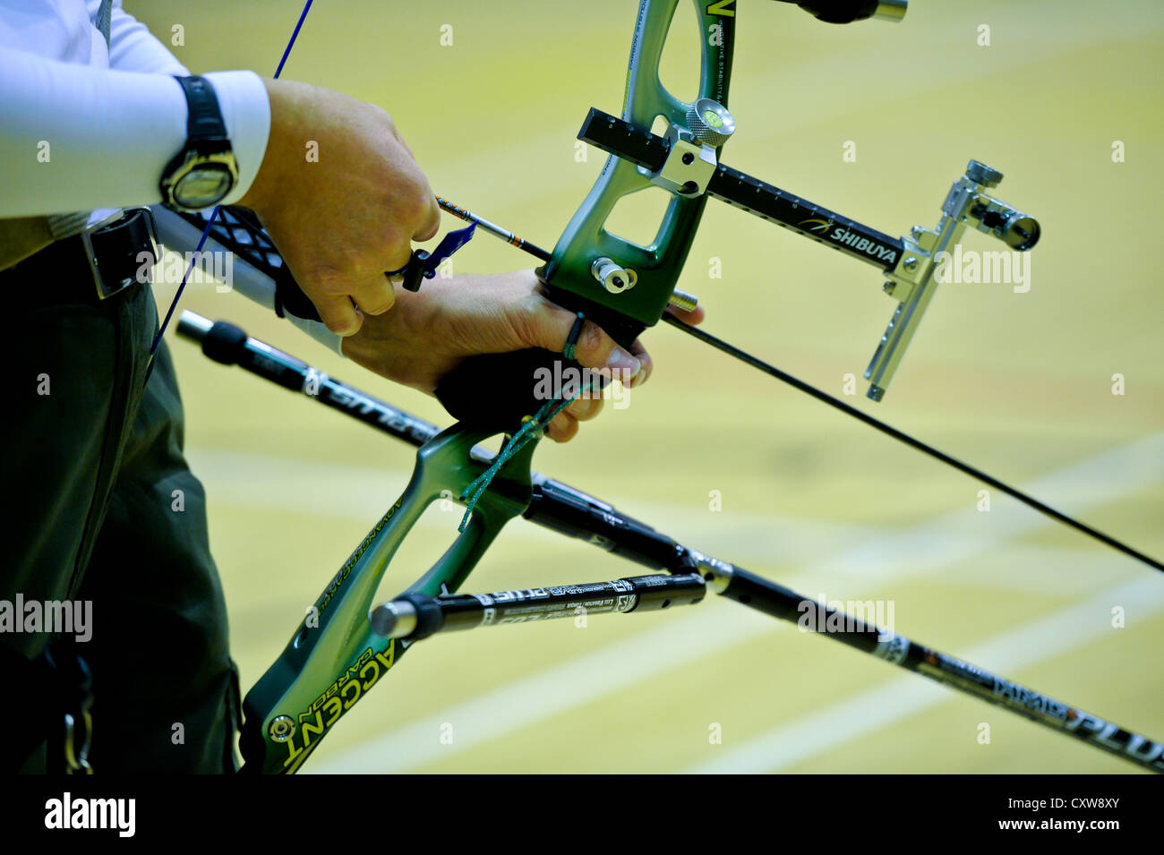 Archers practice during club night. A close up of an arrow being loaded. Stock Photo