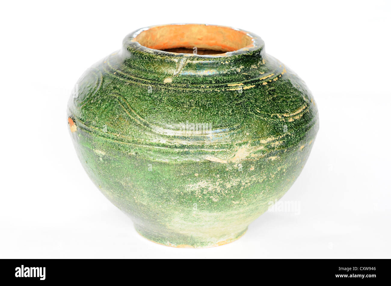 Ancient green pottery jug on a white background Stock Photo