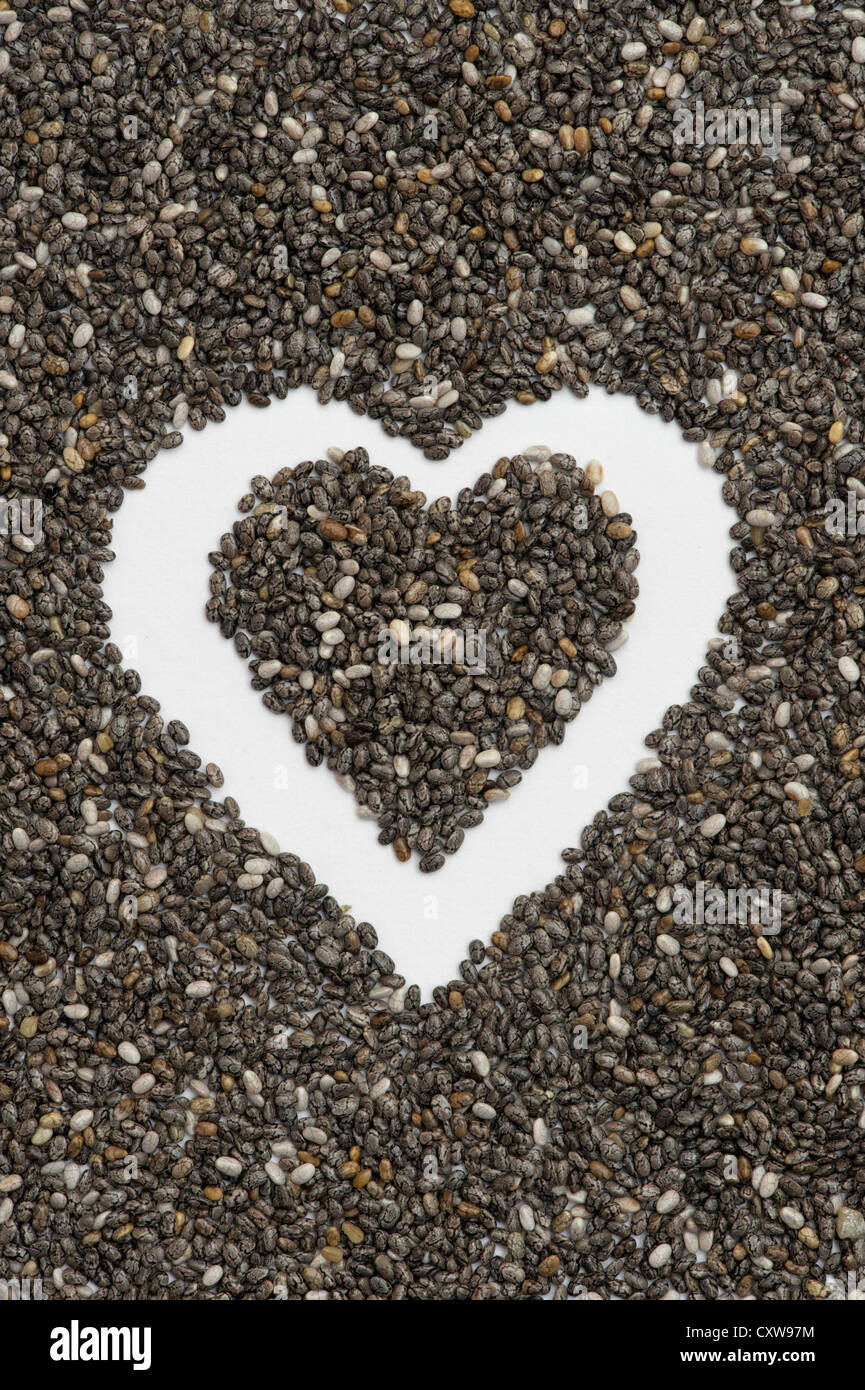 Salvia Hispanica seed. Chia seeds in a heart shape Stock Photo