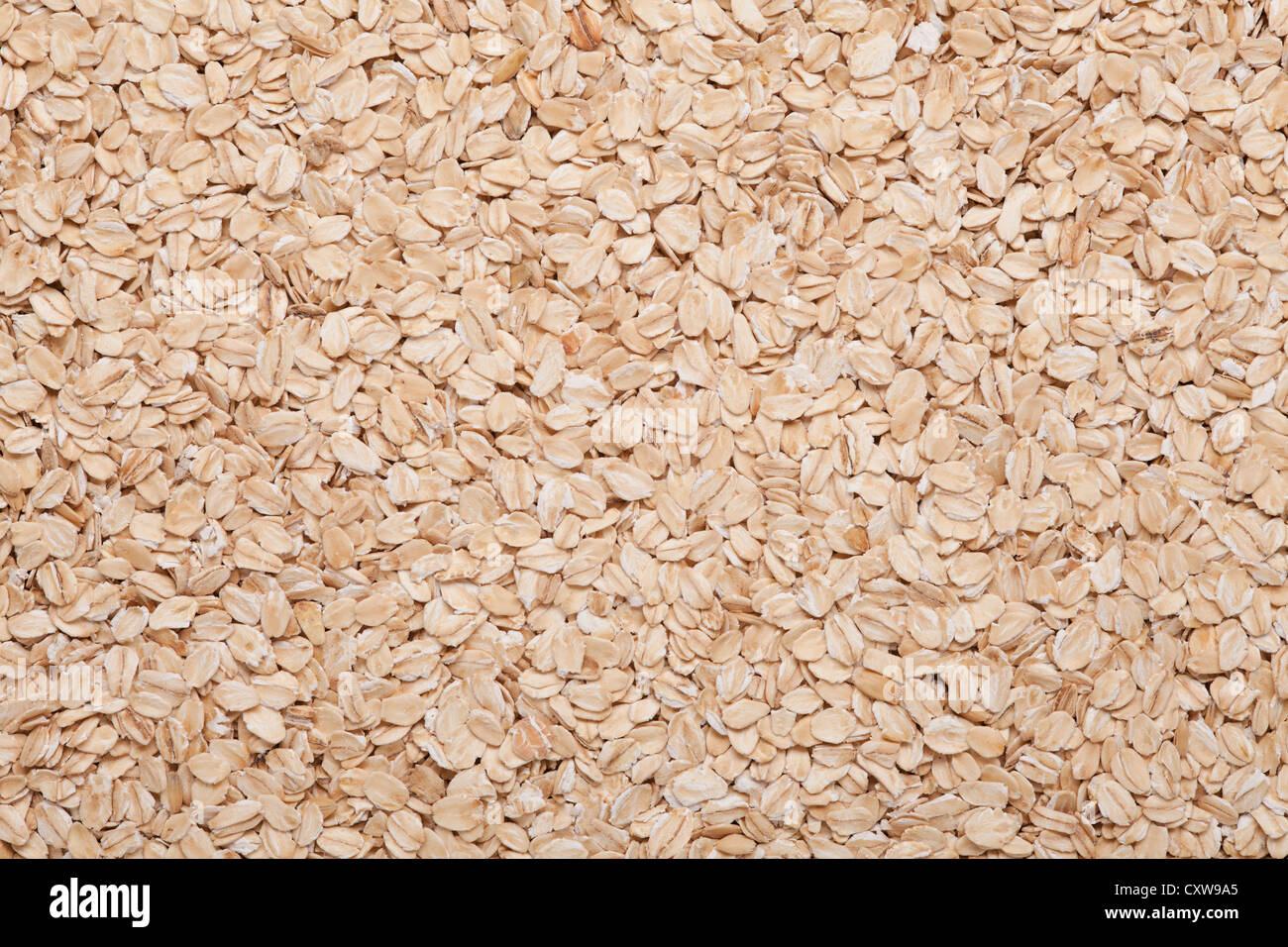 oatmeal background, light brown grain food texture Stock Photo