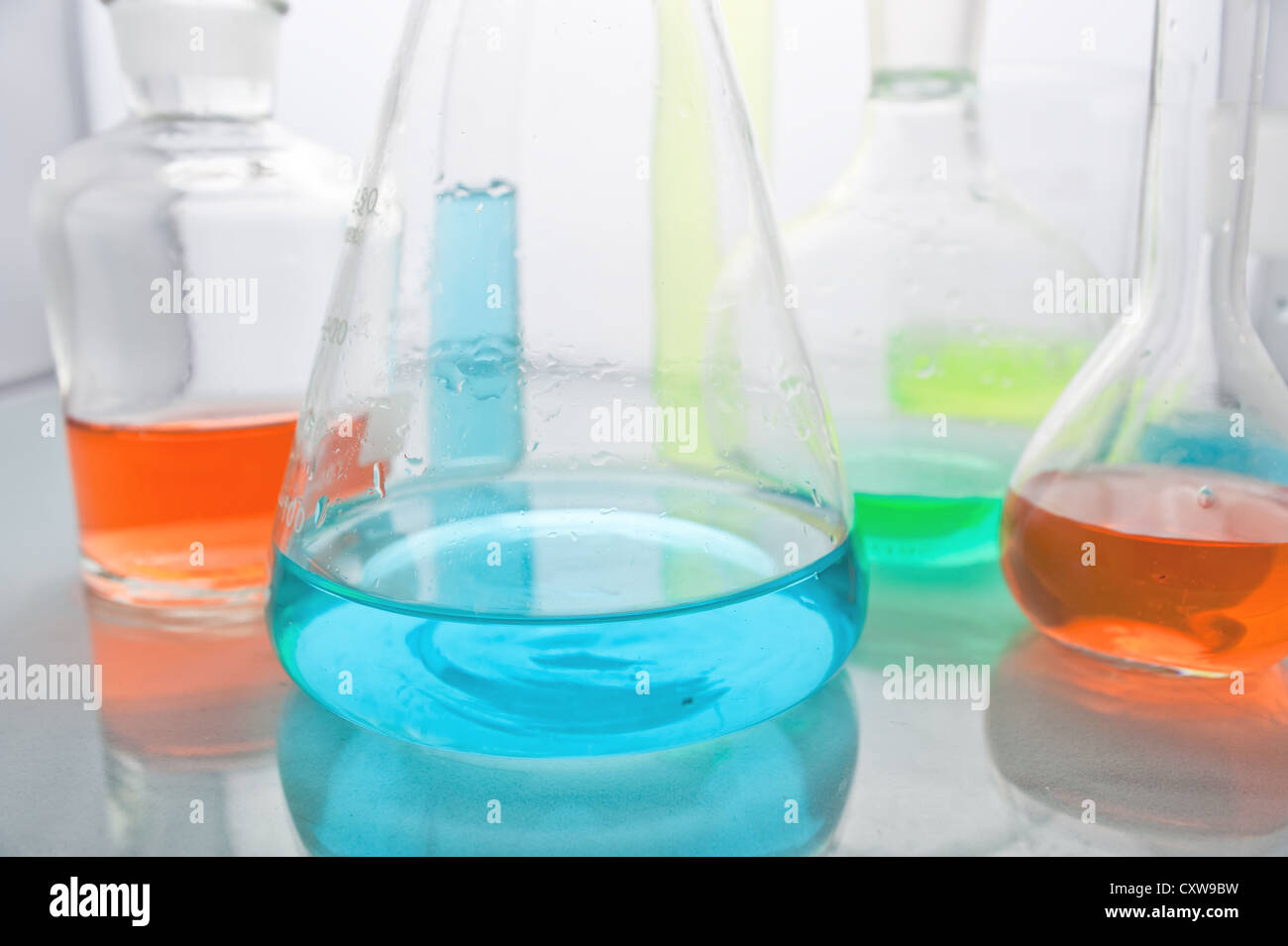 Laboratory glassware with various colored liquids Stock Photo Alamy