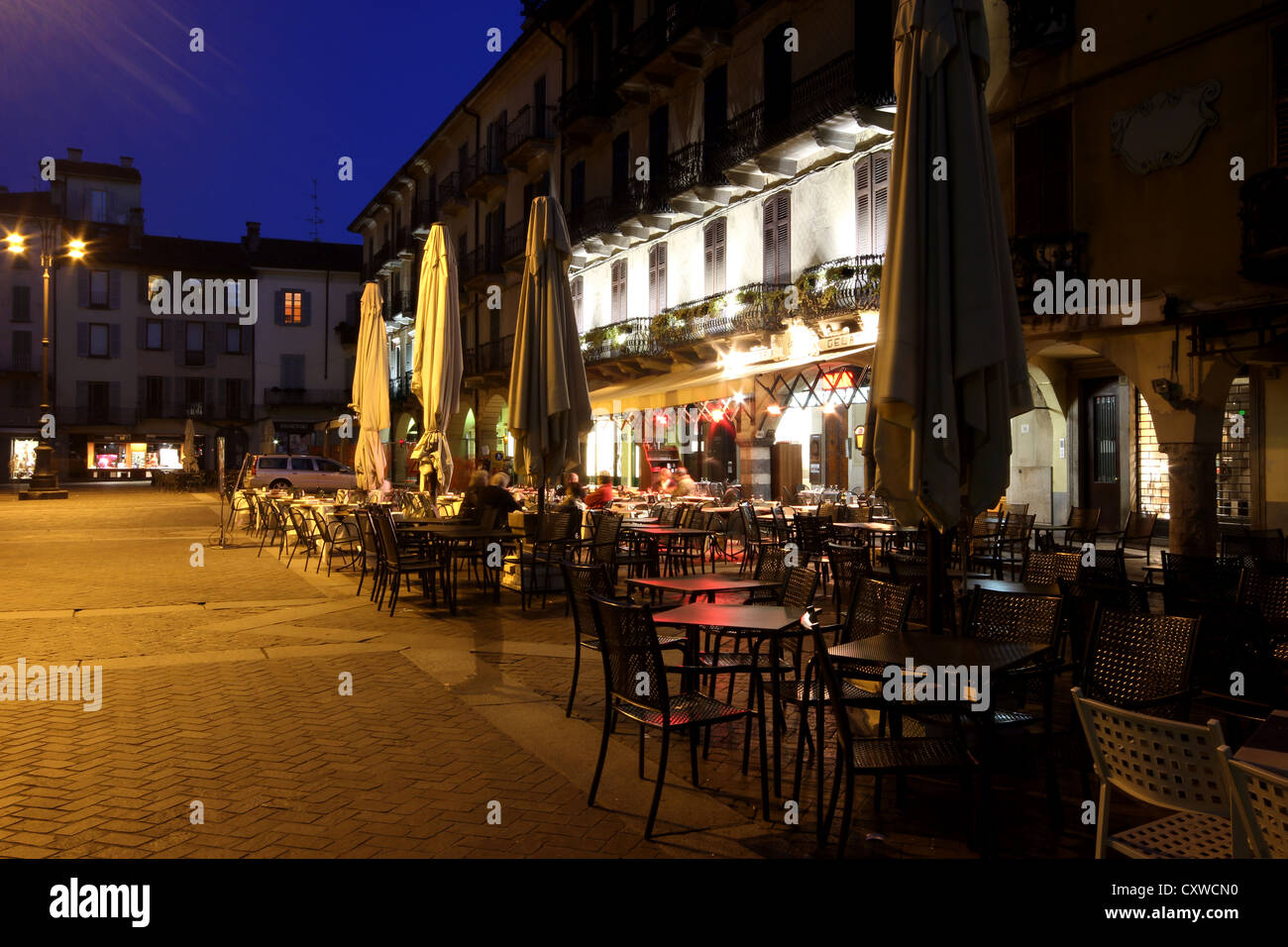 a beautiful picture of the bars of Piazza San Fedele at dusk, Como, Italy, lake, landscape, travel, town, city, photoarkive Stock Photo
