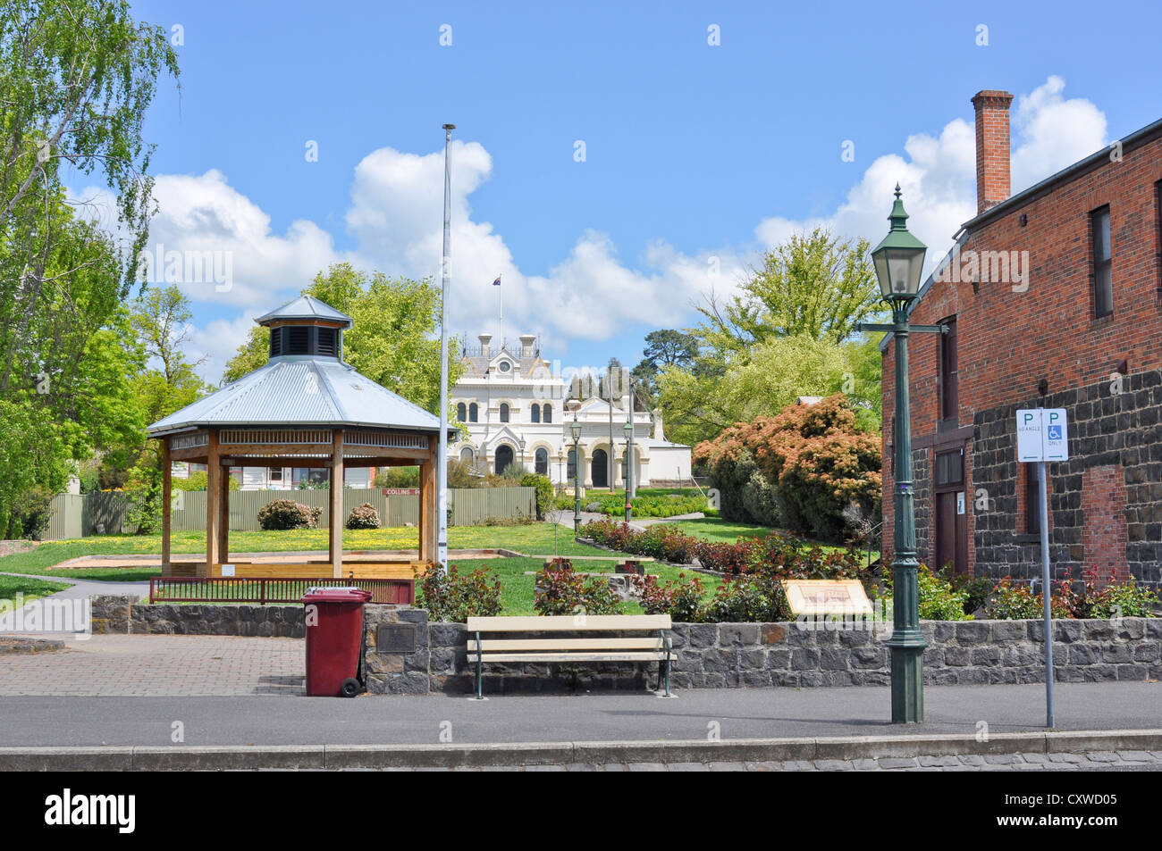 View of historic Clunes Town Hall in Victoria, Australia across Collins Place with bandstand facing Fraser Street. Stock Photo