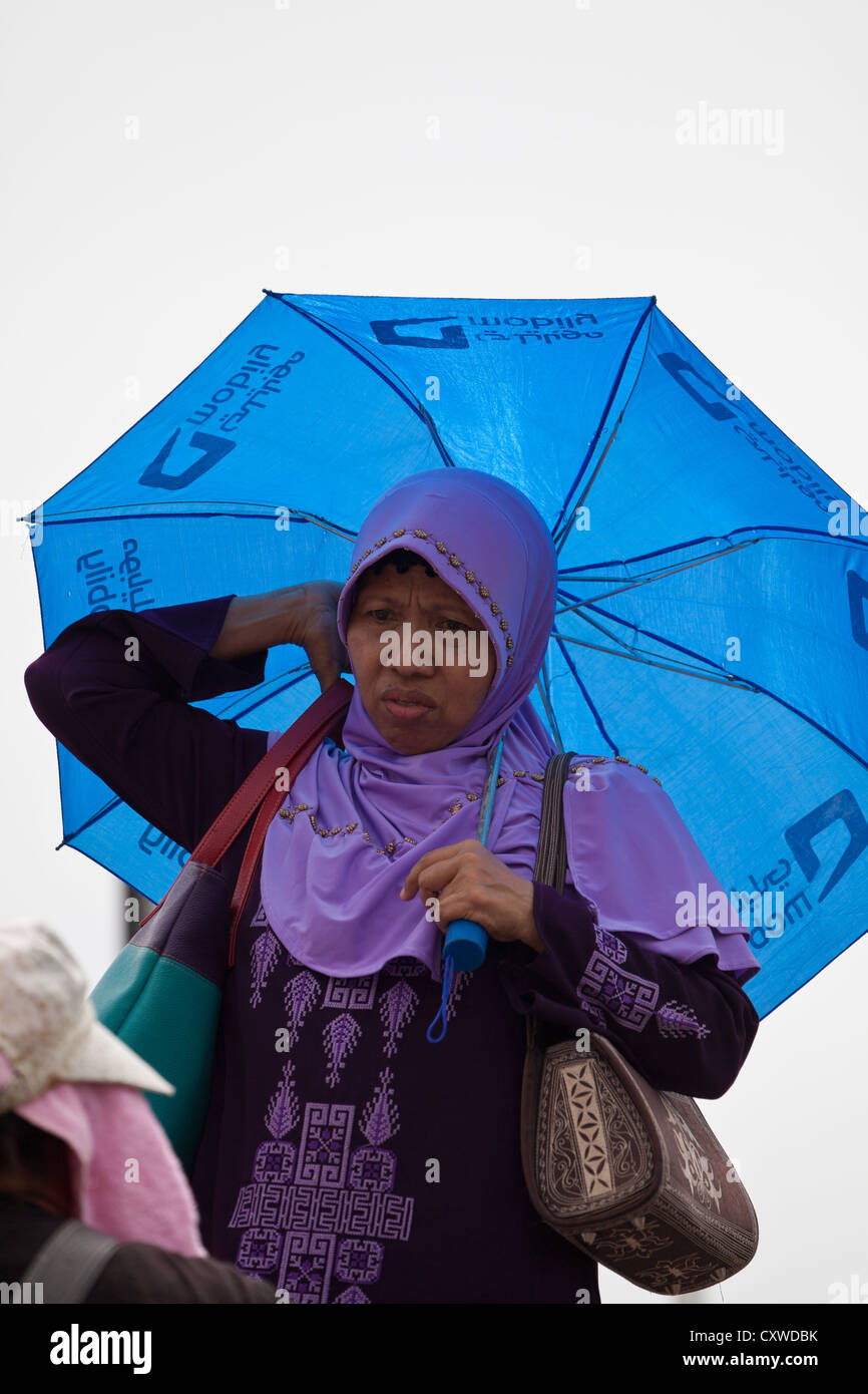 Woman with an Umbrella in Jakarta, Indonesia Stock Photo Alamy