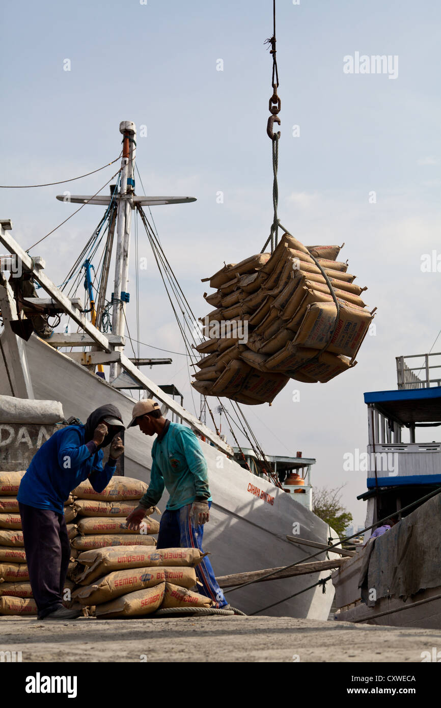 Workers unloading Cement Bags from a Ship in the Port Sunda Kalapa in ...