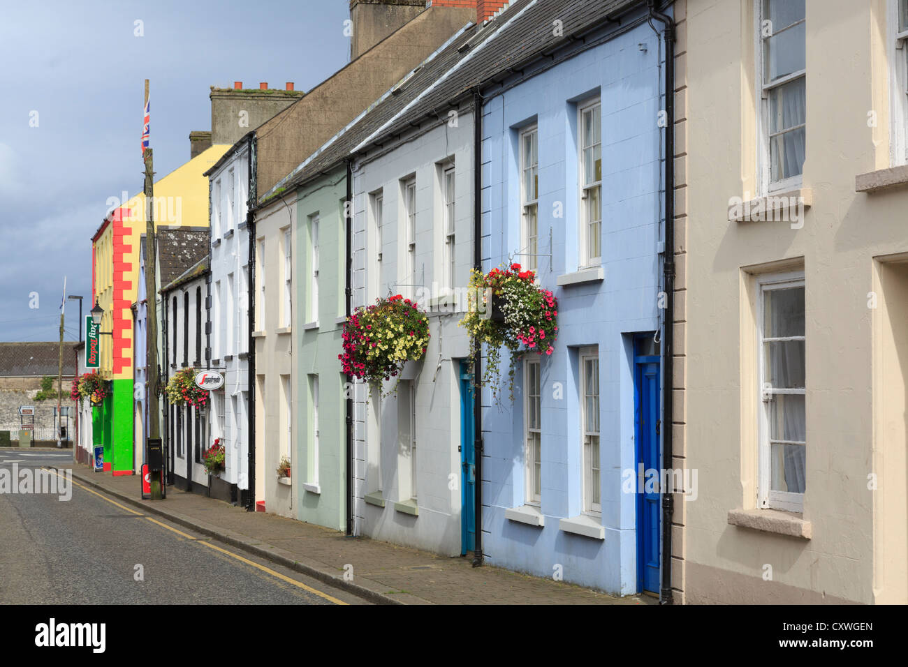 Row of traditional colourful terraced houses on street in
