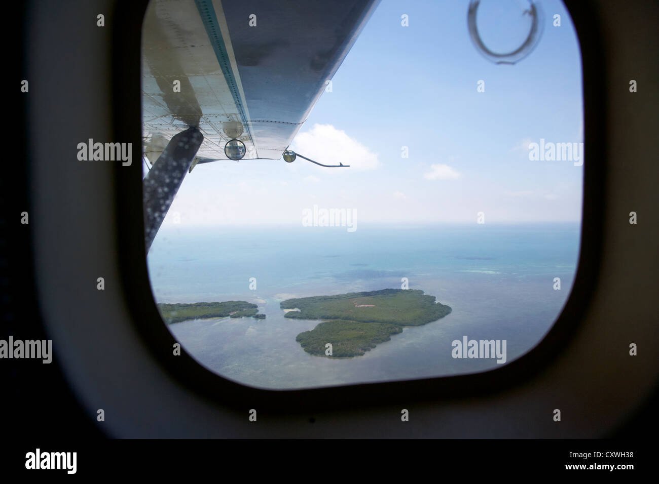 looking out of aircraft window flying over man key in the mule keys part of key west national wildlife refuge islands florida ke Stock Photo