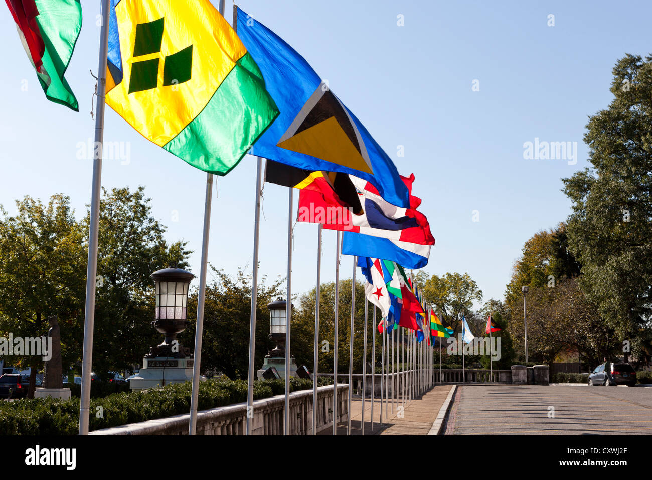 Multi national flags on poles Stock Photo