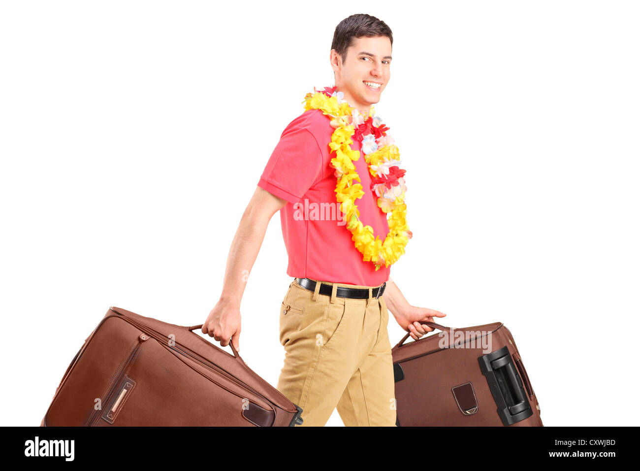 A young male walking with his luggage isolated on white background Stock Photo