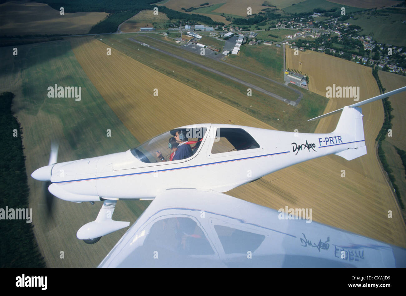 French plane Dynaero MCR-4S flying over Dijon Darois aerodrome, France Stock Photo