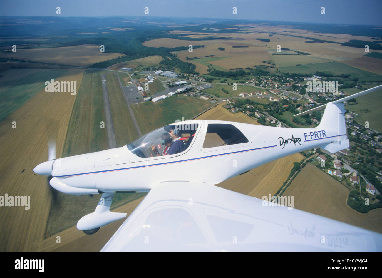 French plane Dynaero MCR-4S flying over Dijon Darois aerodrome, France Stock Photo
