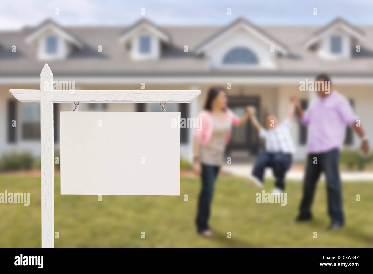 Blank Real Estate Sign and Playful Hispanic Family in Front of House ...
