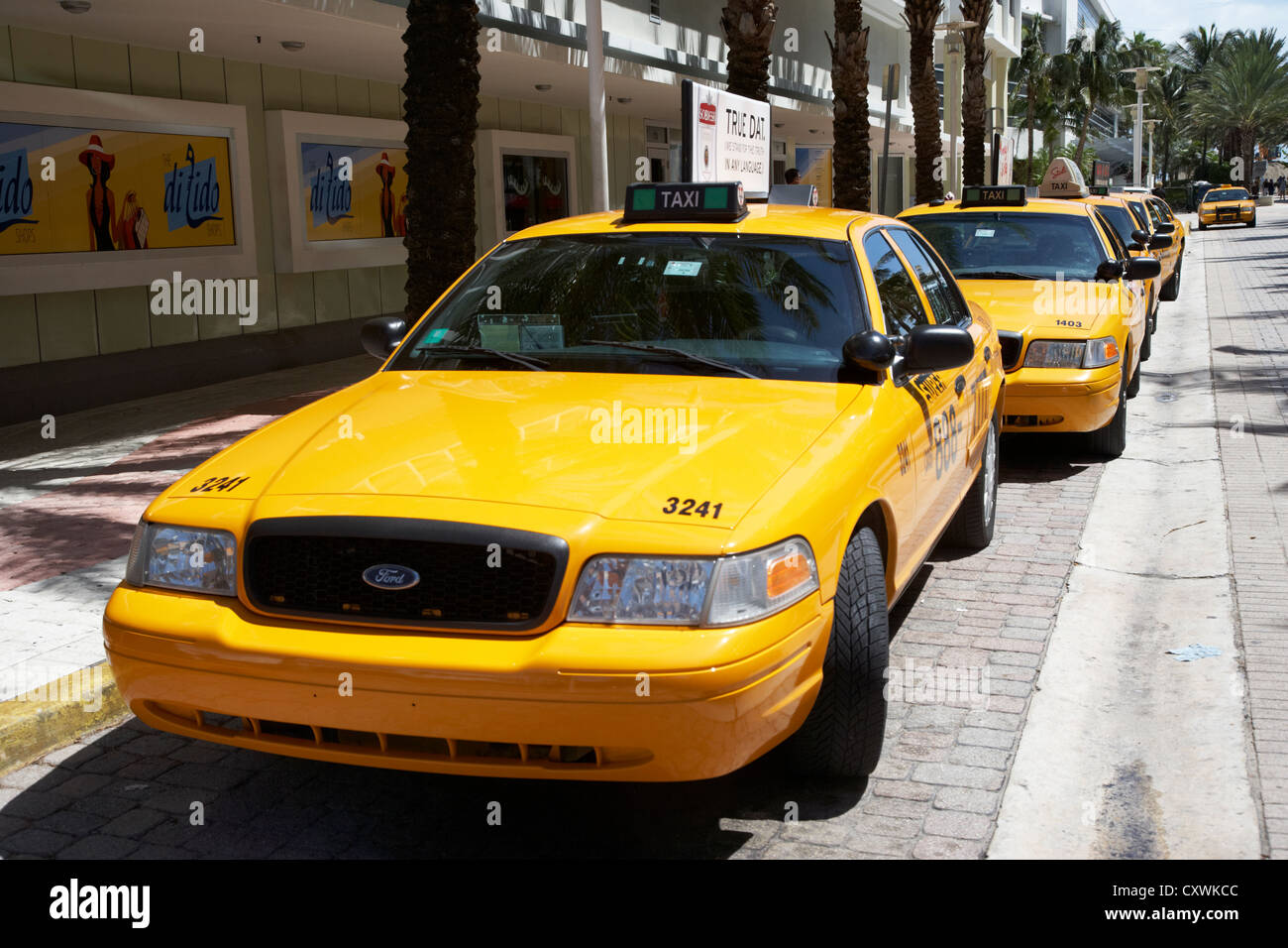 row of yellow cab taxis in miami south beach florida usa Stock Photo
