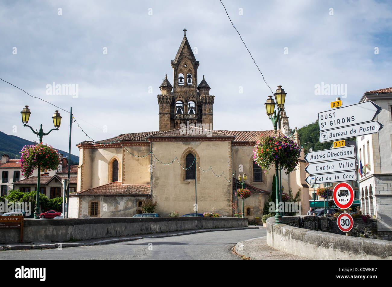 The entry to the village of Seix in the Midi-Pyrenees region of France as seen from the bridge over the River Salat. Stock Photo