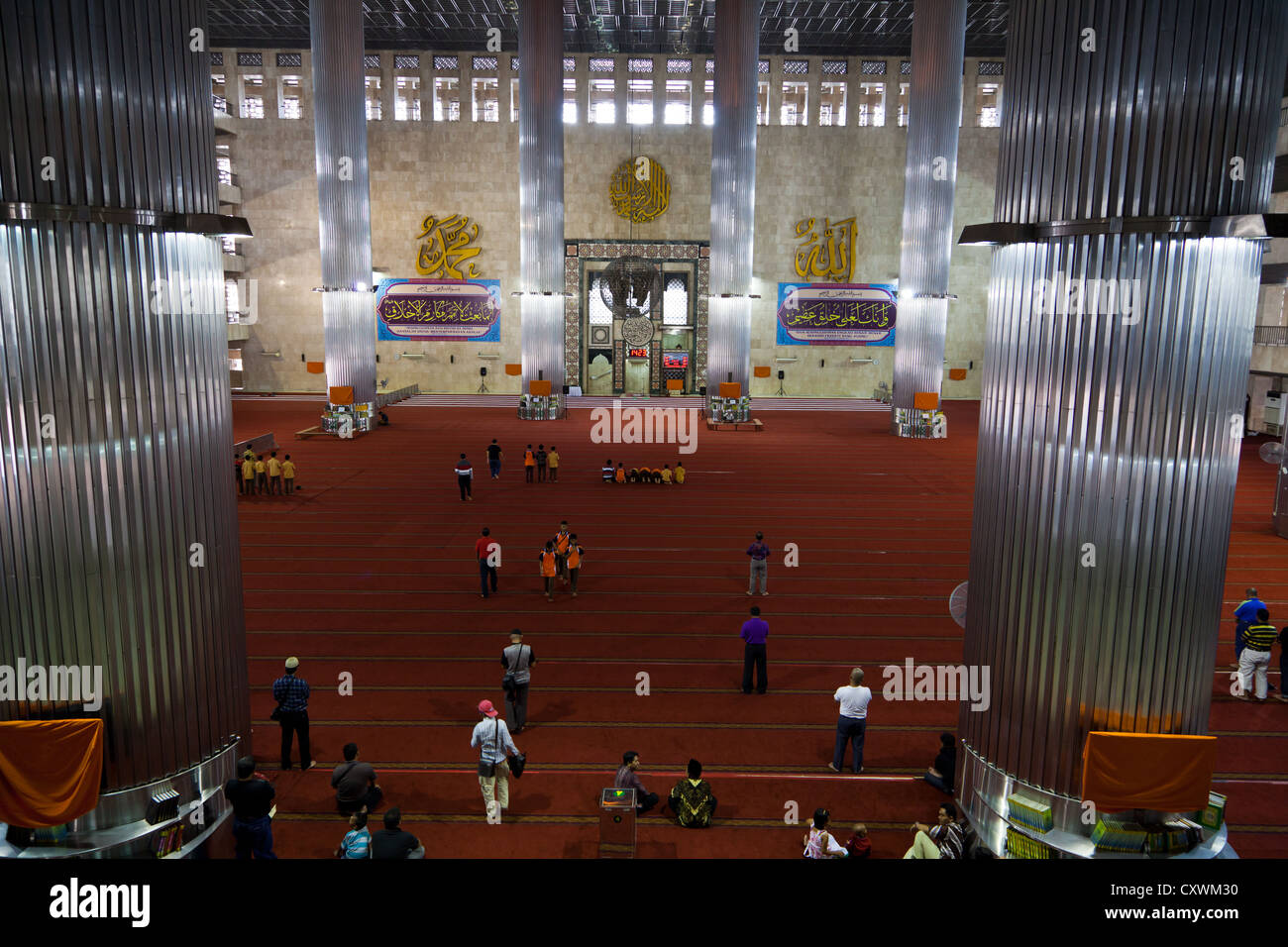 Muslim Believers in the Istiqlal Mosque in Jakarta, Indonesia Stock Photo