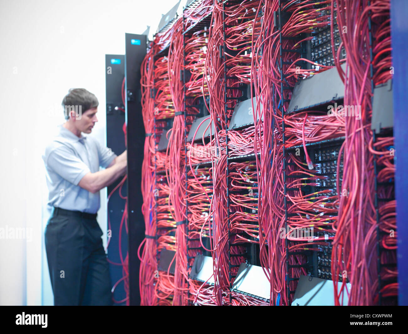 Man working in server room Stock Photo Alamy