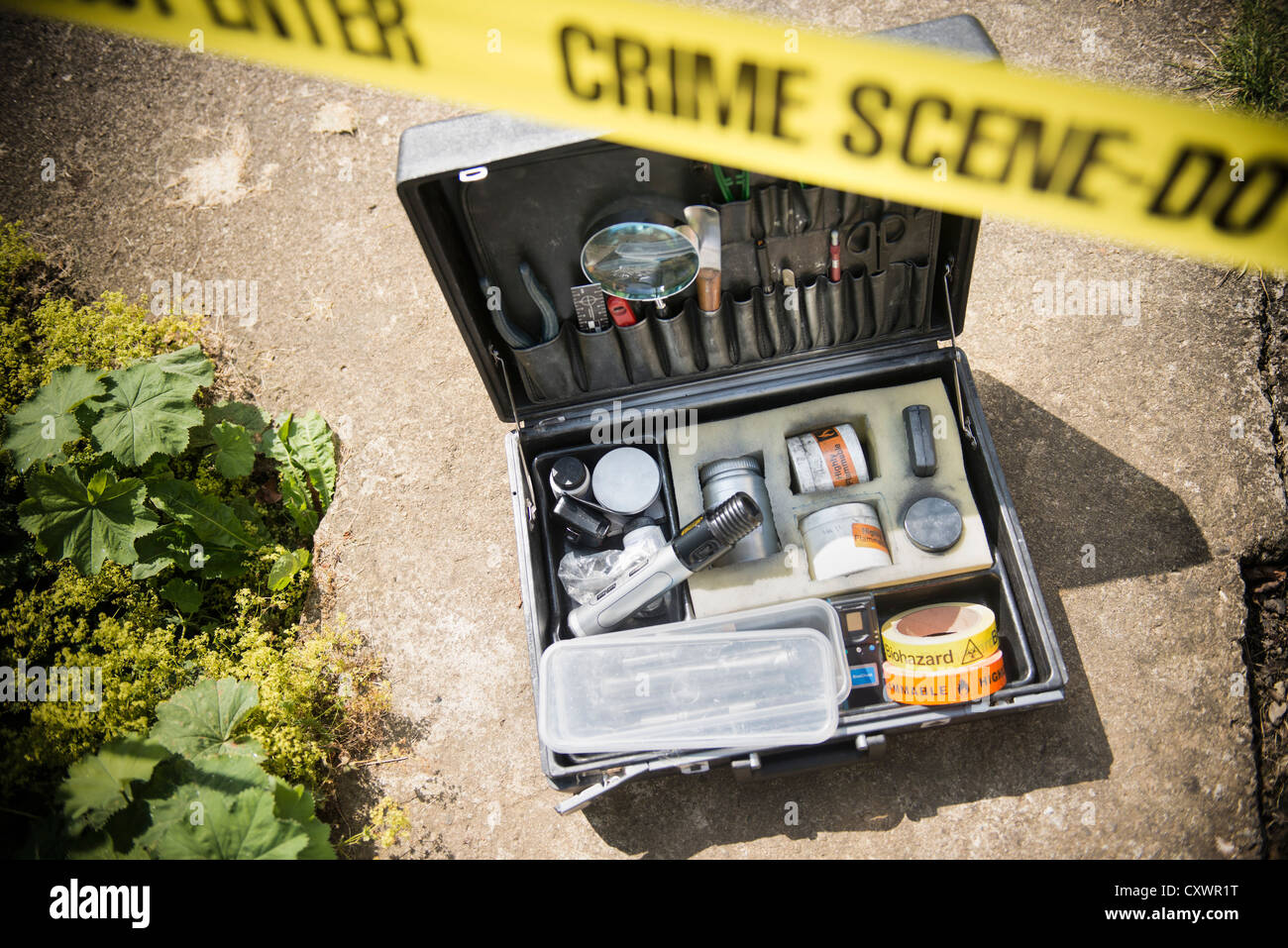 Box of forensic equipment at crime scene Stock Photo