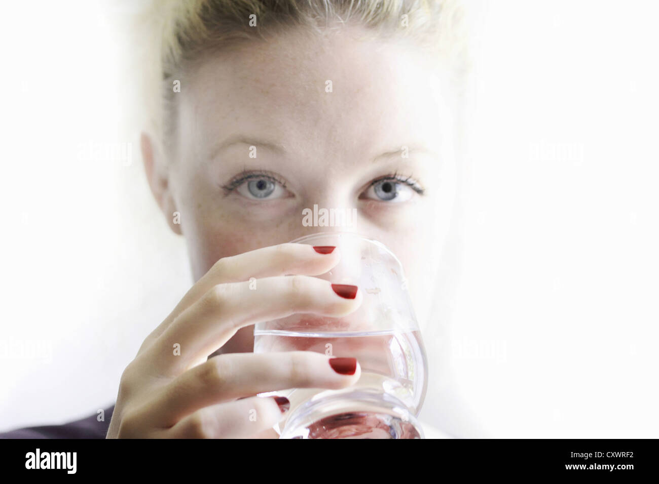 Close up of woman drinking glass of wine Stock Photo - Alamy