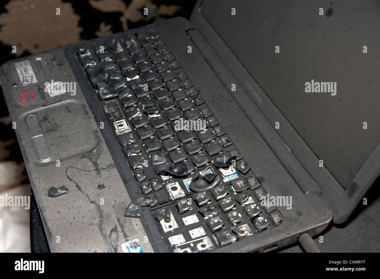 Fire damaged melted laptop PC electrical fault Stock Photo Alamy