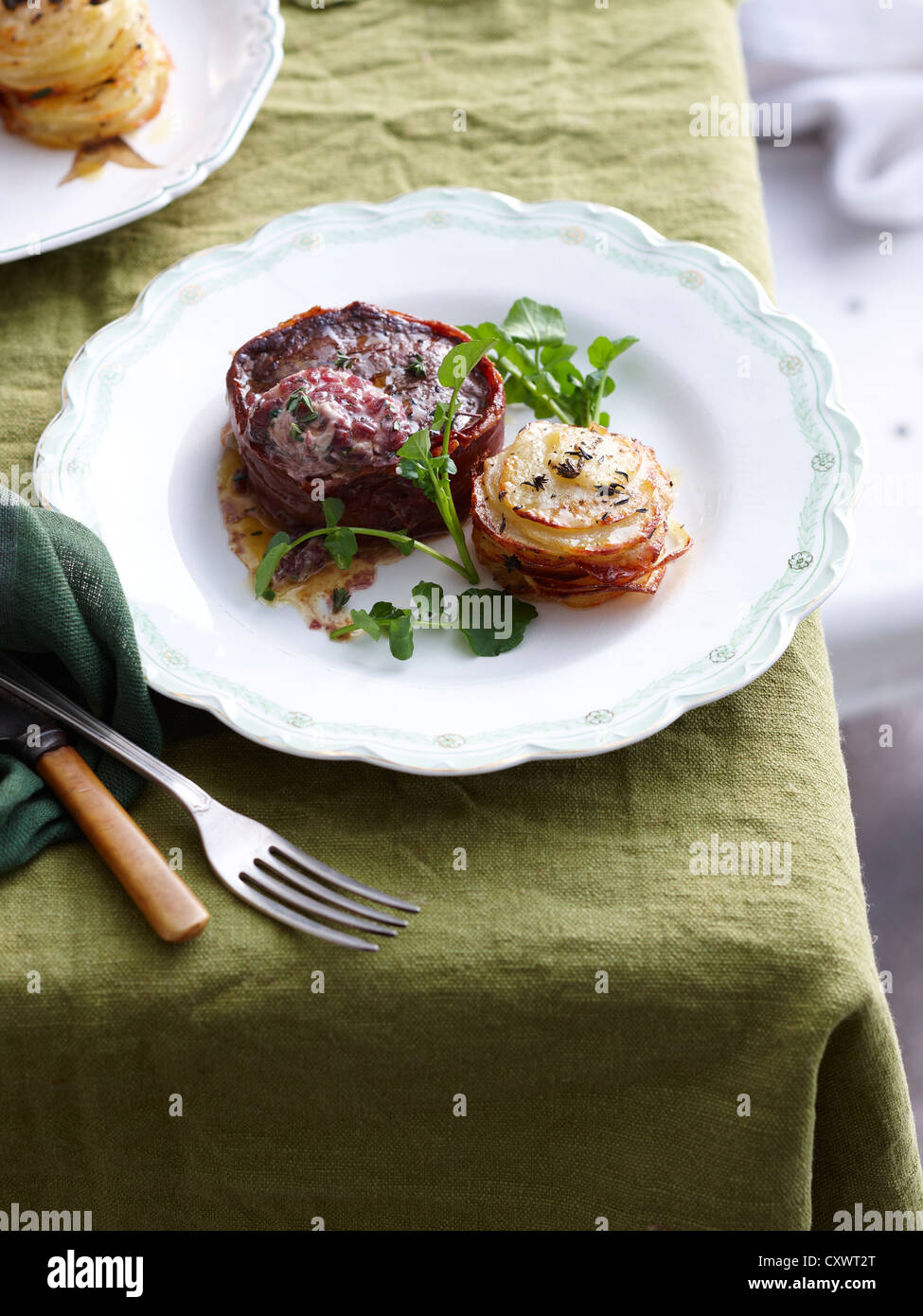 Plate of beef proscuitto steak Stock Photo
