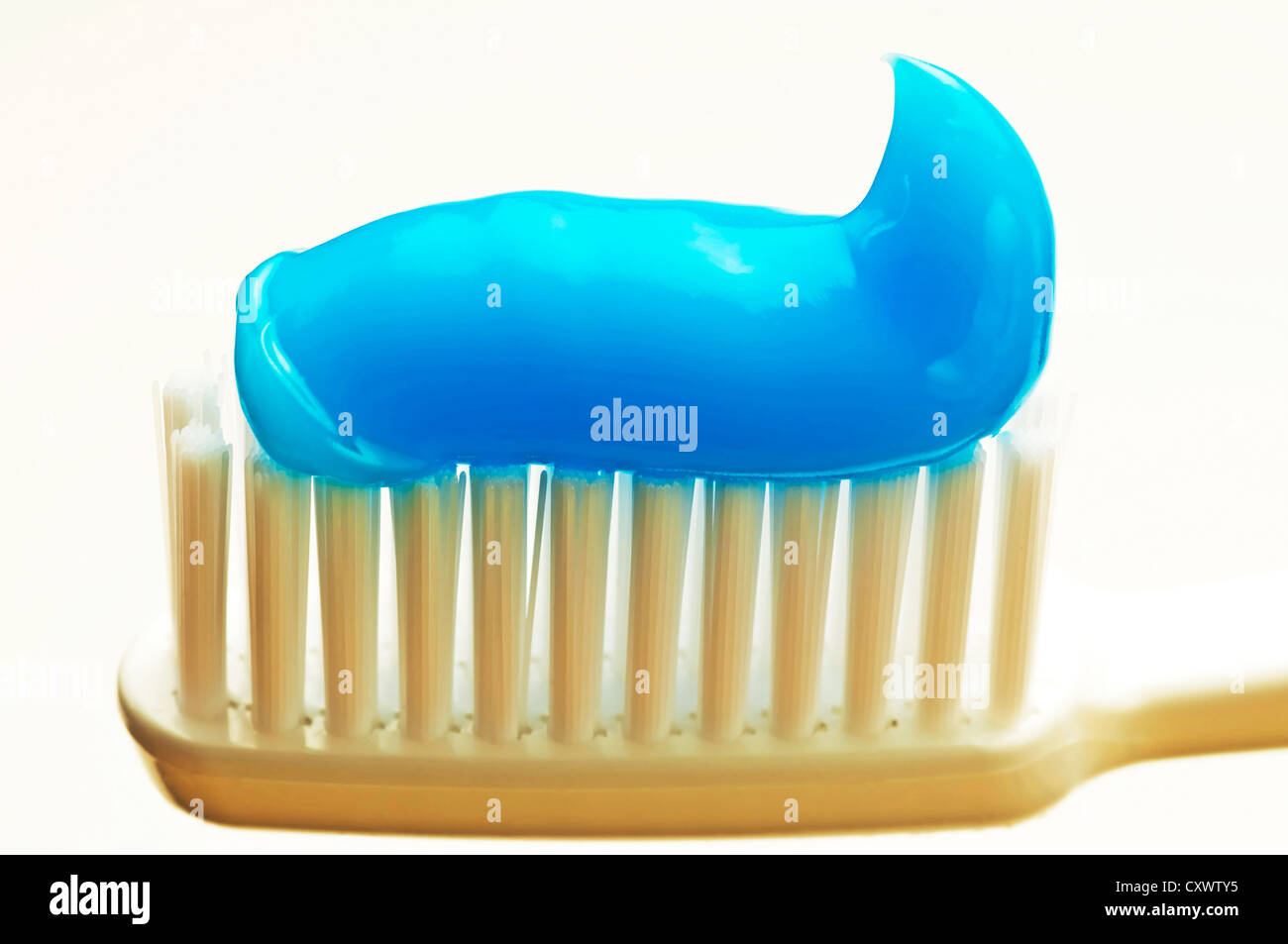 toothbrush with blue toothpaste Stock Photo - Alamy
