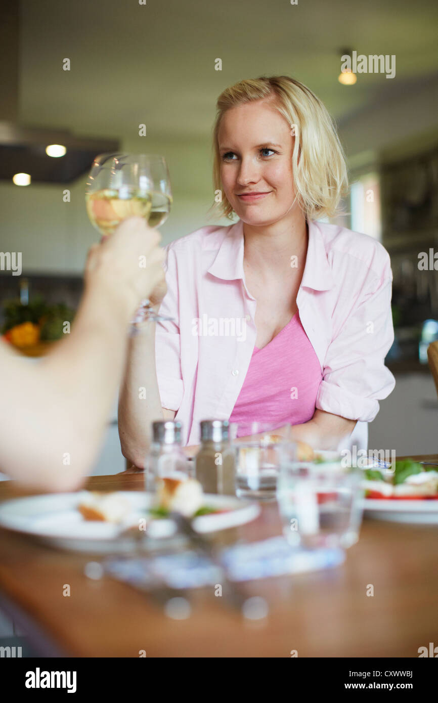 Couple toasting each other at dinner Stock Photo Alamy
