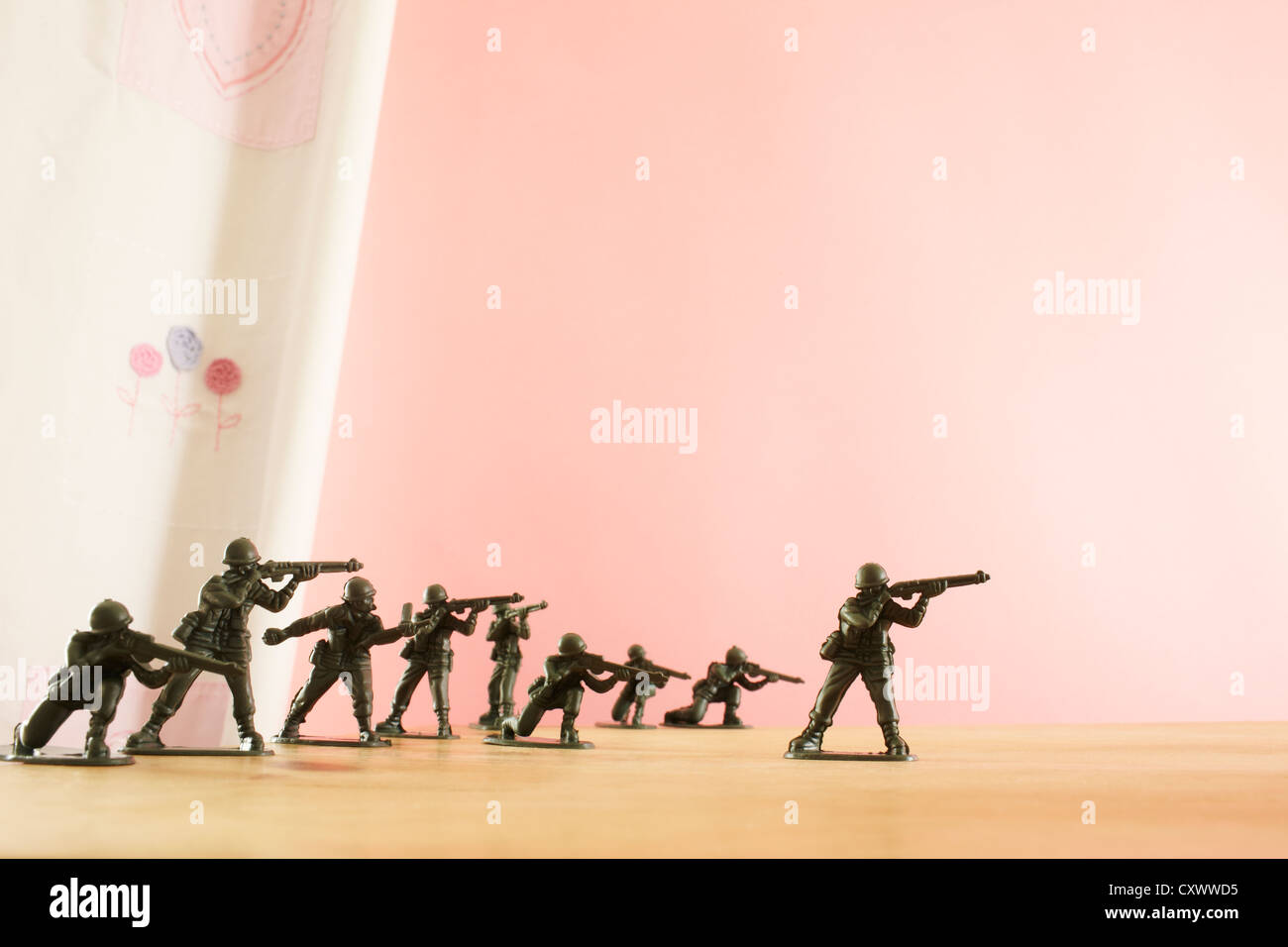 Toy soldiers waiting for unseen danger Stock Photo