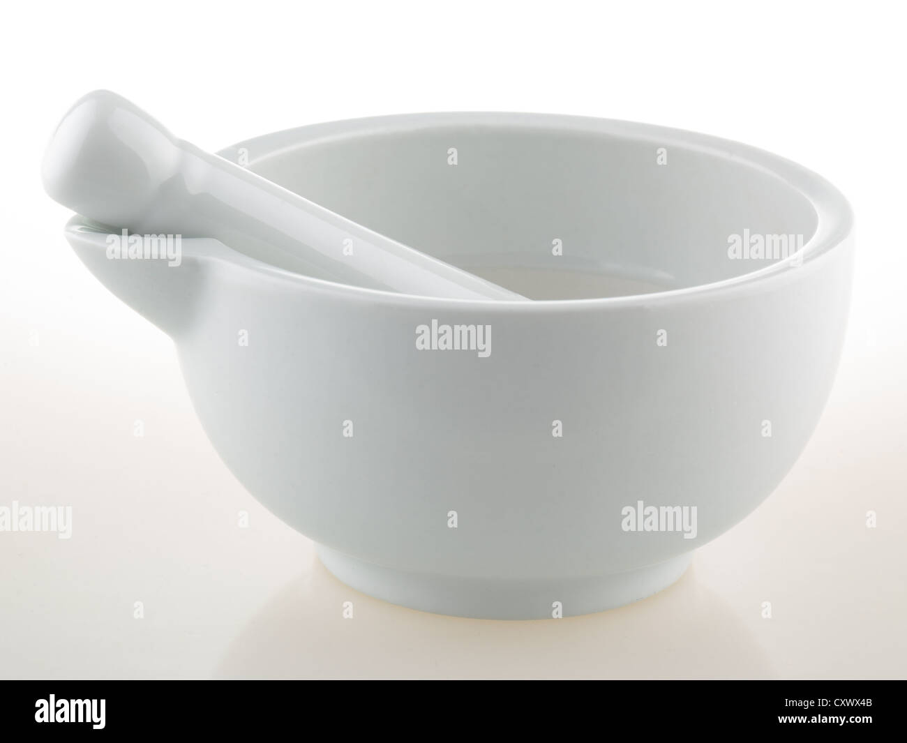 White porcelain mortar and pestle set Stock Photo Alamy