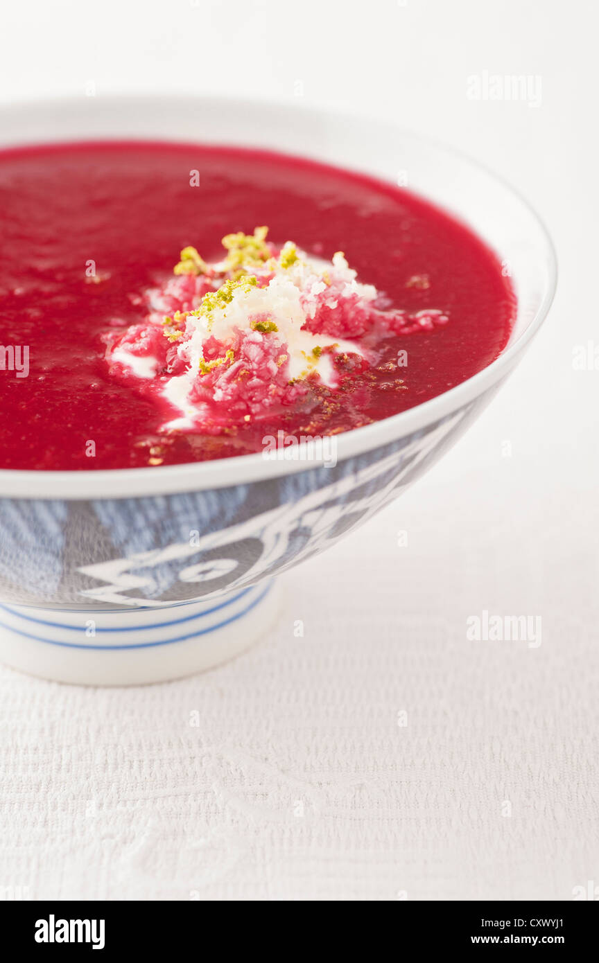 Traditional russian beetroot soup served chilled with sourcream, horse-radish and lime peel Stock Photo