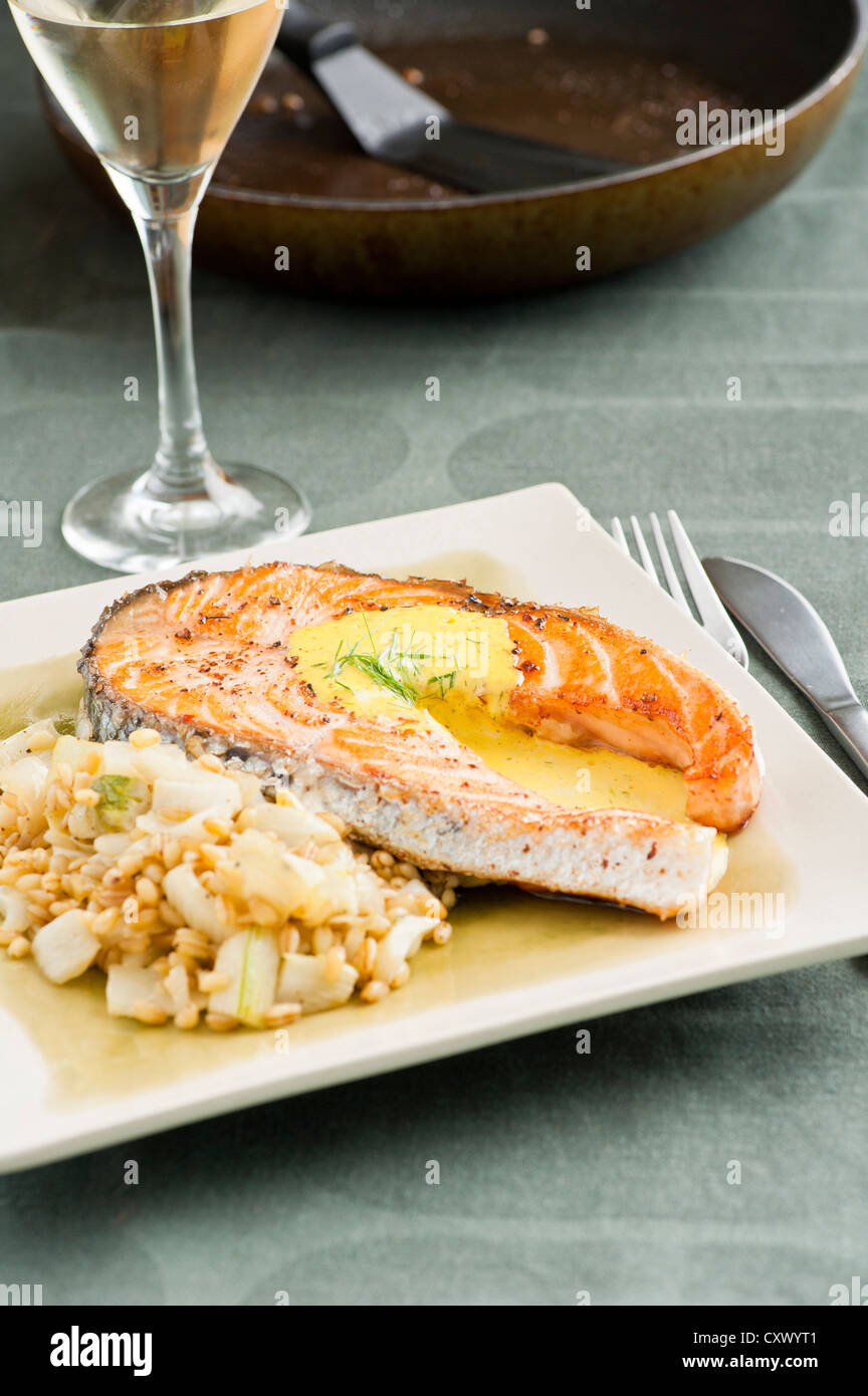 Seafood meal with fried salmon, bulgur, fennel and aioli Stock Photo
