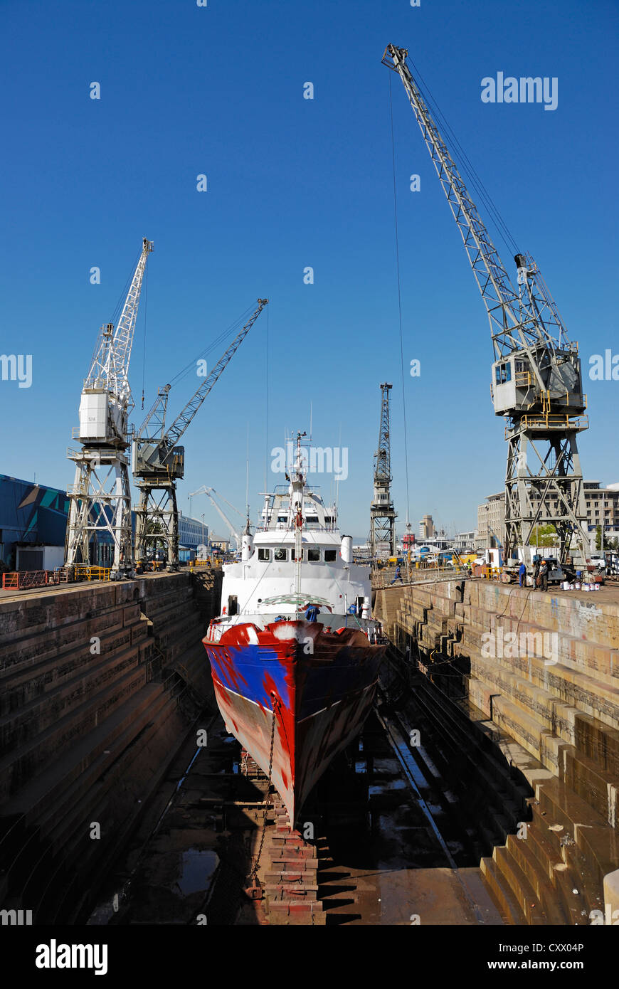 Ship being repaint in a dry dock, Cape Town, South Africa Stock Photo