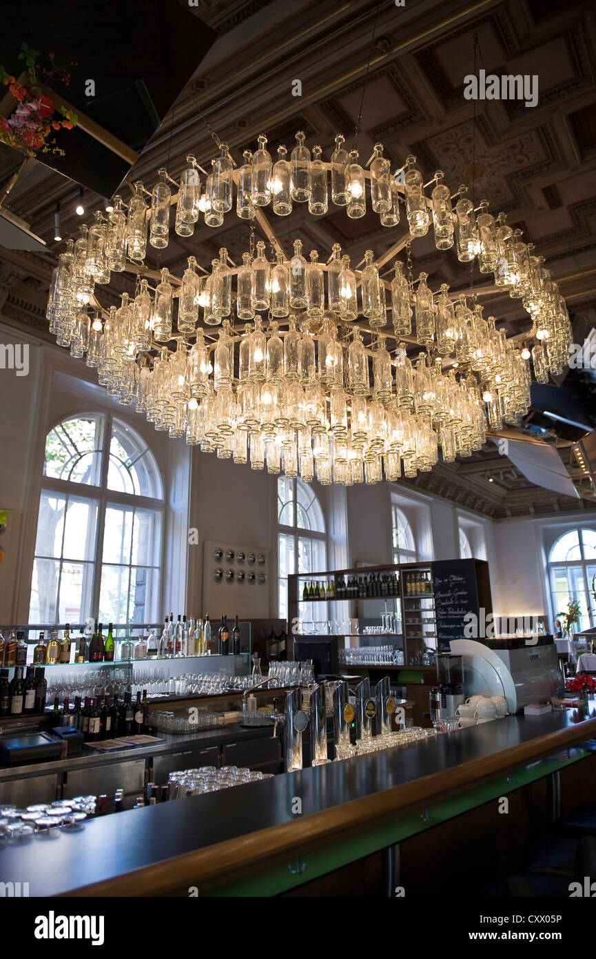 Clear glass bottle chandelier in the bar and restaurant of the MAK Applied Arts Museum in Vienna, Austria Stock Photo