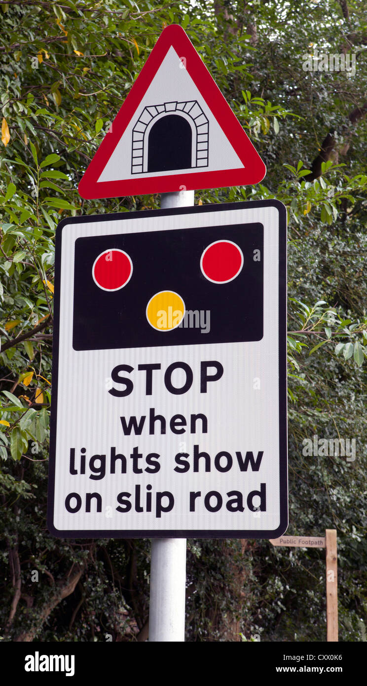 Stop when lights show on slip road warning sign on the approach to the