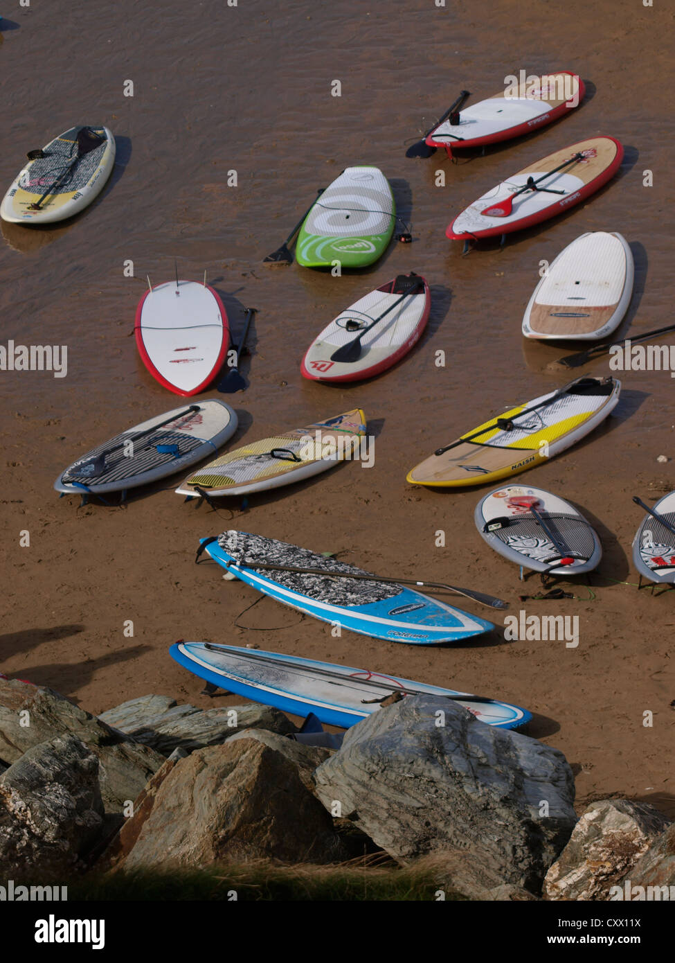 Lots of paddleboards on the beach, UK Stock Photo Alamy